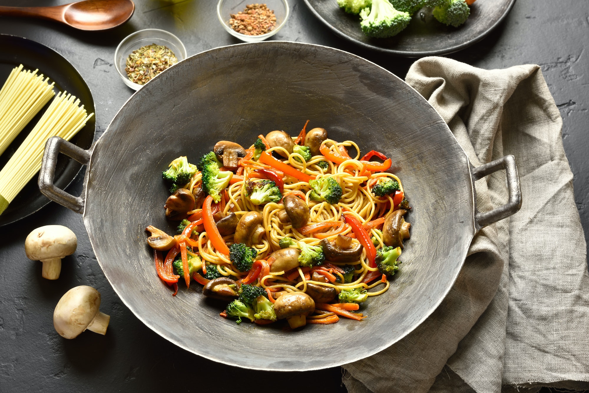 Noodles with vegetables in wok